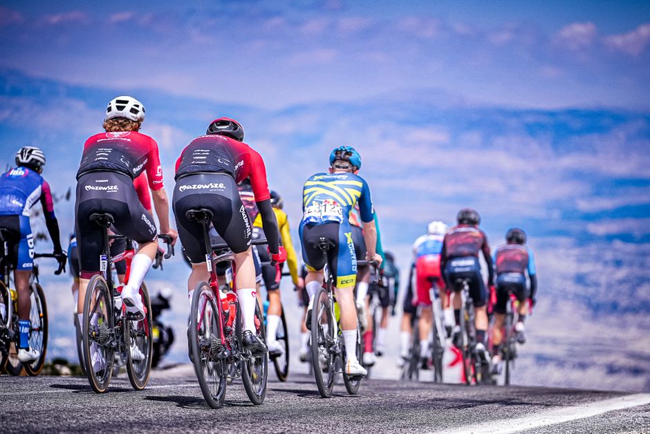 Dynamic road cycling race with competitive cyclists on scenic route in Mersin, Türkiye.