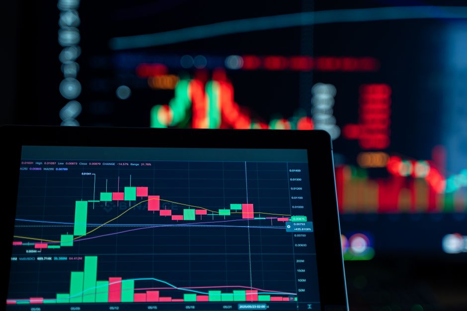 Close-up view of digital trading chart screen with vibrant graphs and data analysis.